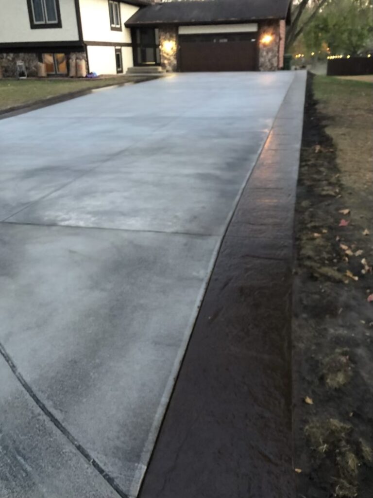 concrete patio with border by minnesnow at minnetonka Minnesota